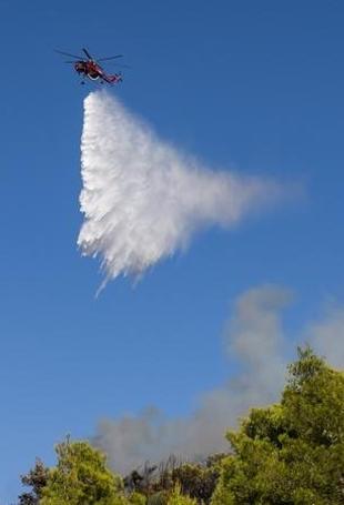 Greece battles new fire driven by winds