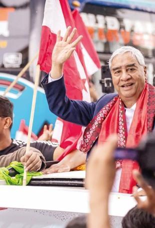 Former Nepalese PM Deuba returns home