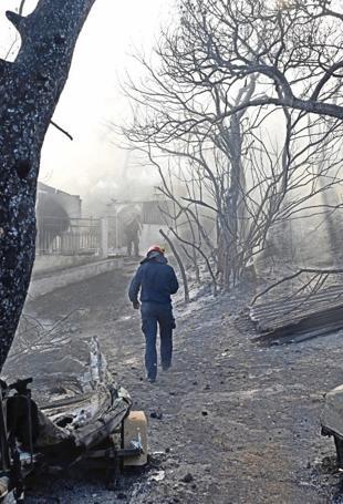 Fires near Athens controlled after claiming two lives