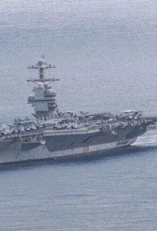 Iran claims missile strikes on US carrier, destroyer