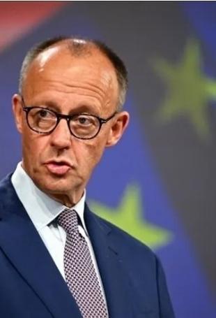 Merz visits Kyiv as Russia urges diplomats to leave
