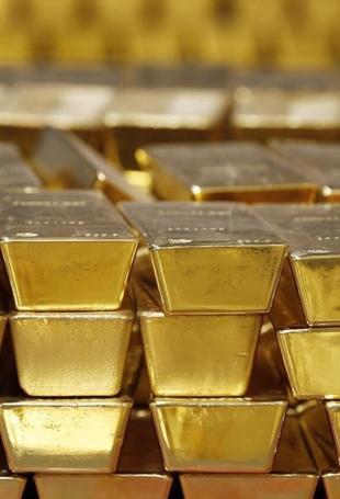 Gold slips as dollar and bond yields weigh