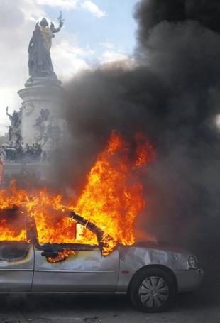 Protests banned in parts of Paris as Macron swipes at Trump