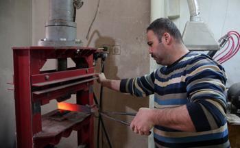 Veteran officer makes historical war tools in workshop