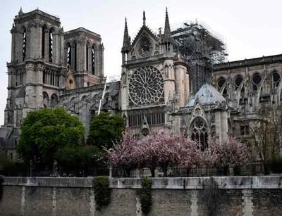Notre-Dame fire extinguished, Macron vows to rebuild