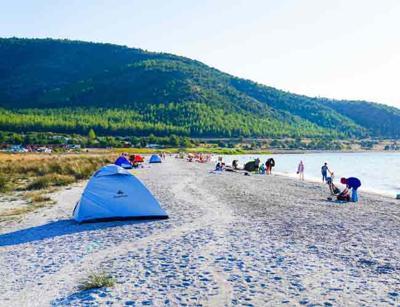 Turks pitch tents for budget-friendly vacations