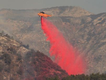 Break in winds helps California battle historic wildfire