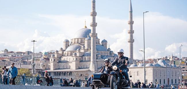 Tourists explore Istanbul on retro motorcycles