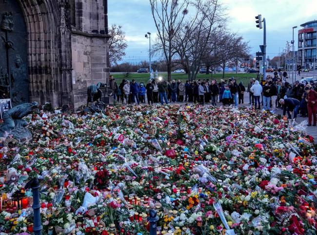 Germany pledges security inquest into Christmas market attack