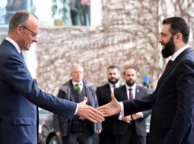 Germany tries to play down row over Syria refugee return