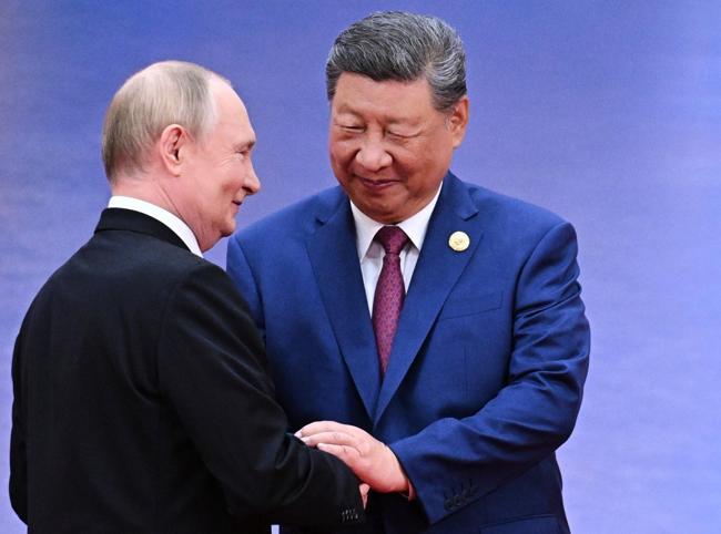 Xi hosts Putin in Beijing days after Trump