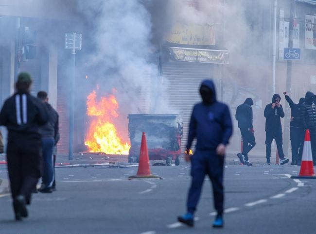 Protesters torch buildings and vehicles, block roads over Belfast stabbing