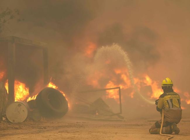 More than 200,000 flee out-of-control wildfires in France, Spain