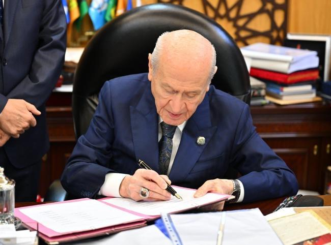 Bahçeli first to sign bill tied to anti-terror initiative