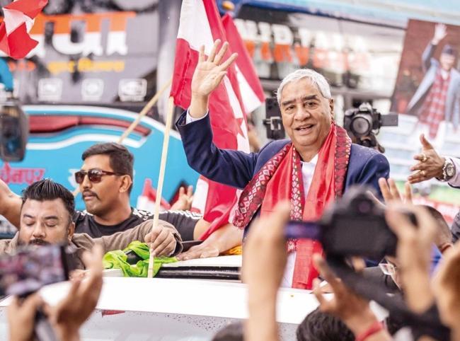 Former Nepalese PM Deuba returns home
