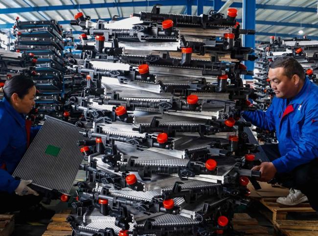 China factory activity returns to growth in September