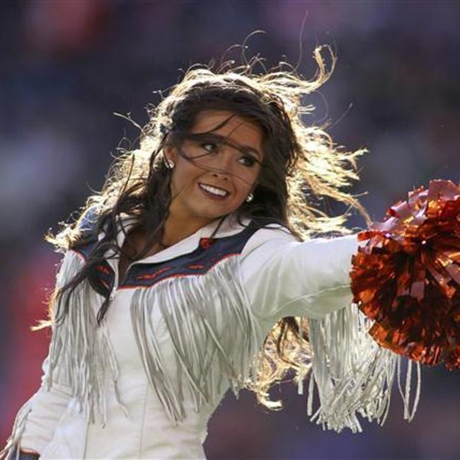 An Arizona Cardinals cheerleader performs a routine during the