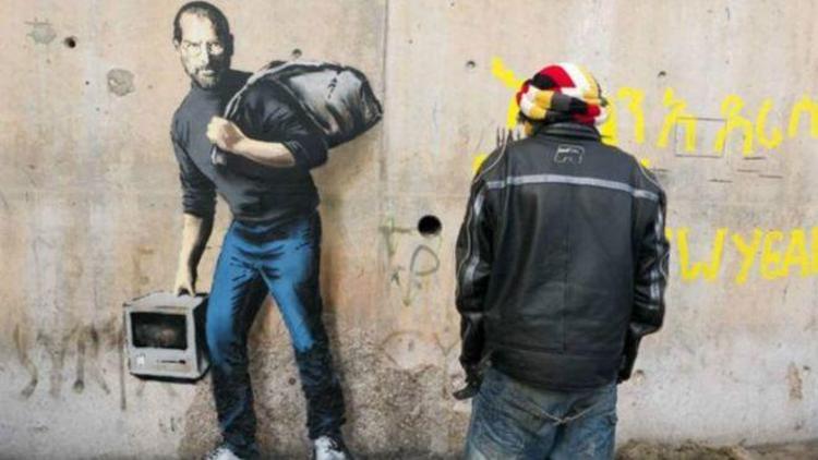Banksy, mülteci kampında göçmen Steve Jobsu çizdi
