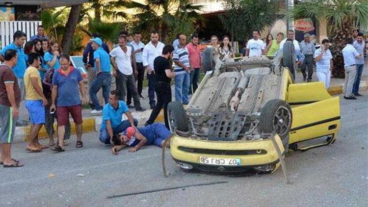 Takla atan araçtan sıyrıklarla kurtuldu