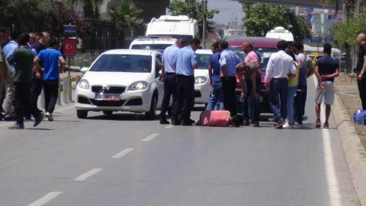 Eşiyle tartışan koca, otomobilin önüne atladı