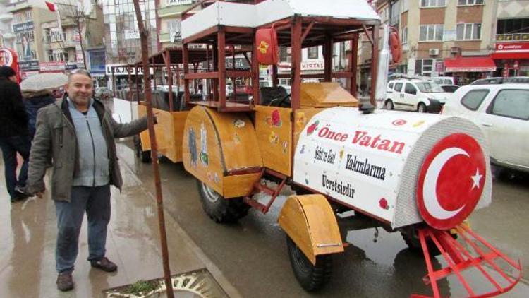 Eski traktörünü gezi trenine dönüştürdü