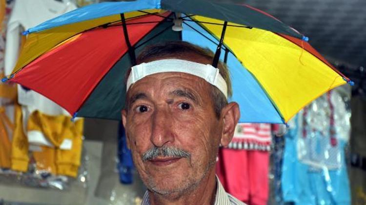 Bunaltıcı sıcaklarda şemsiye şapkalar talep görüyor