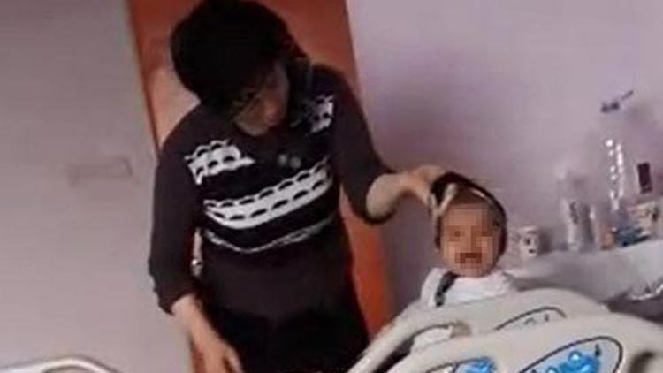 Hasta bebeğini ağladığı için döverken görüntülendi, gözaltına alındı
