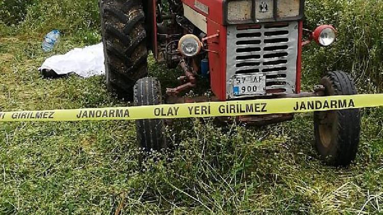 Traktöre bağlı ot biçme makinesine sıkışan çiftçi öldü