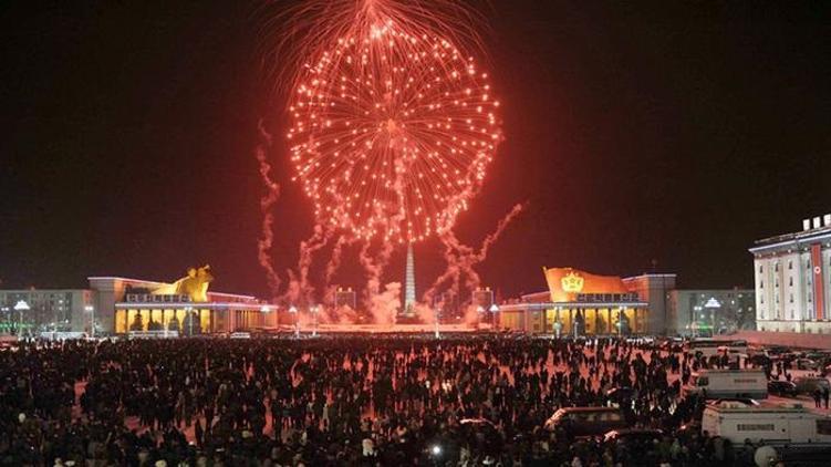 New Year fireworks, smoke and tear gas as decade begins with a bang