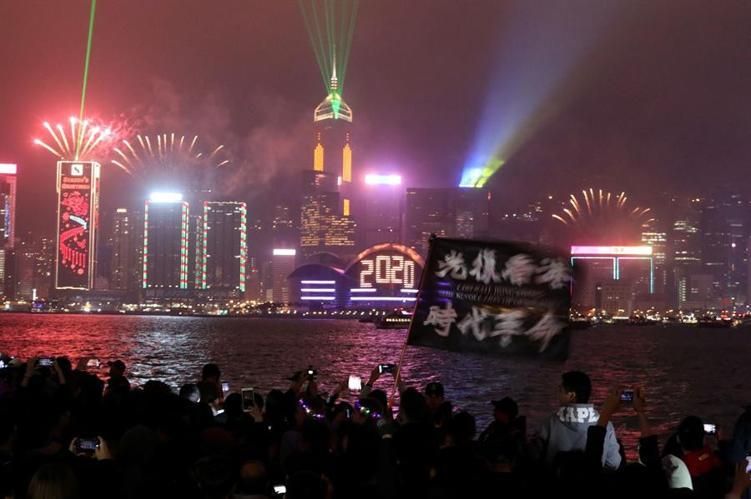 New Year fireworks, smoke and tear gas as decade begins with a bang
