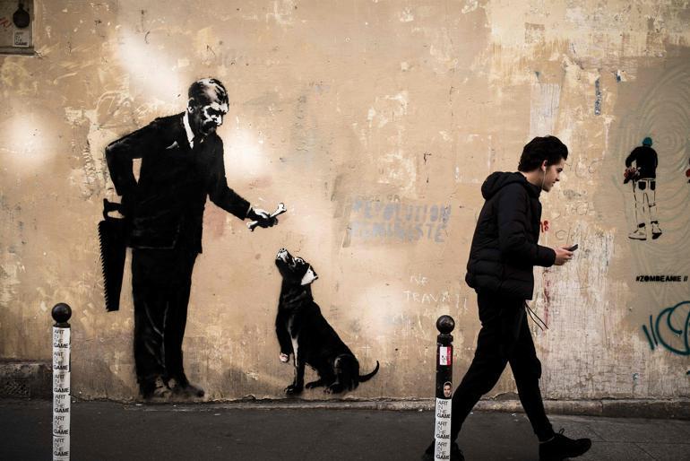 Banksy needles France with migrant mural blitz in Paris