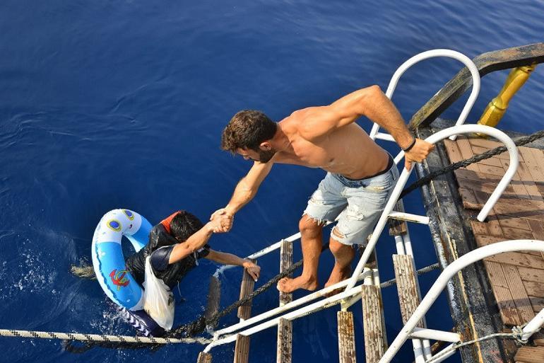 Migrant with child swim ring saved by tourist boat amid desperate bid to cross from Turkey to Greece