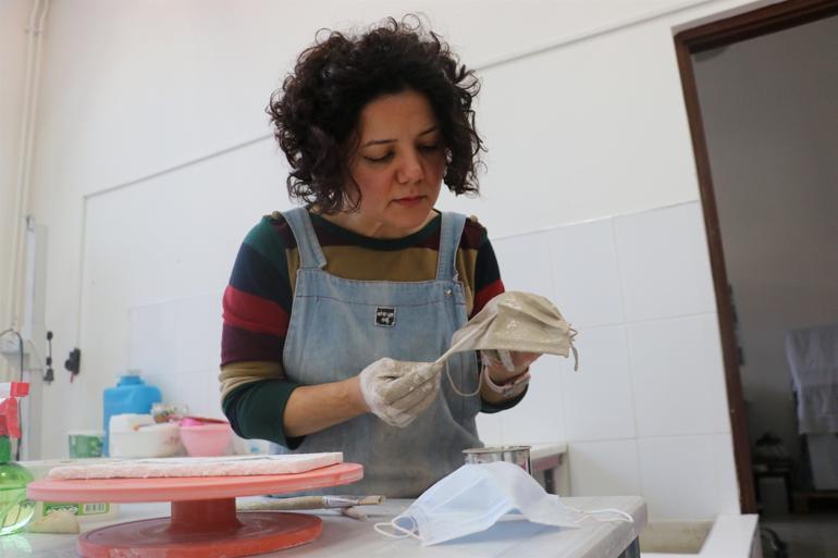 Ceramic artist makes porcelain masks