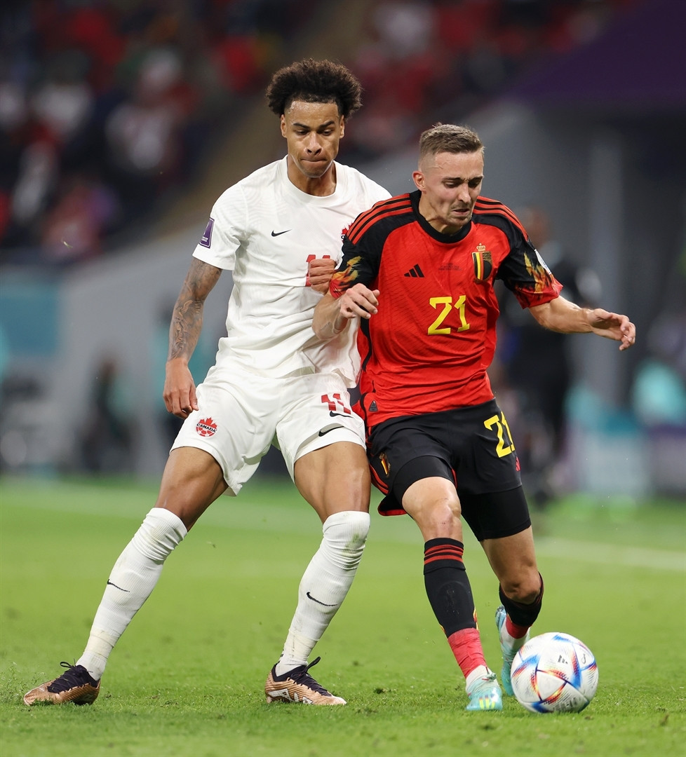DOHA, QATAR - NOVEMBER 23: Tajon Buchanan of Canada battles for possession with Timothy Castagne of Belgium  during the FIFA World Cup Qatar 2022 Group F match between Belgium and Canada at Ahmad Bin Ali Stadium on November 23, 2022 in Doha, Qatar. (Photo by Catherine Ivill/Getty Images)