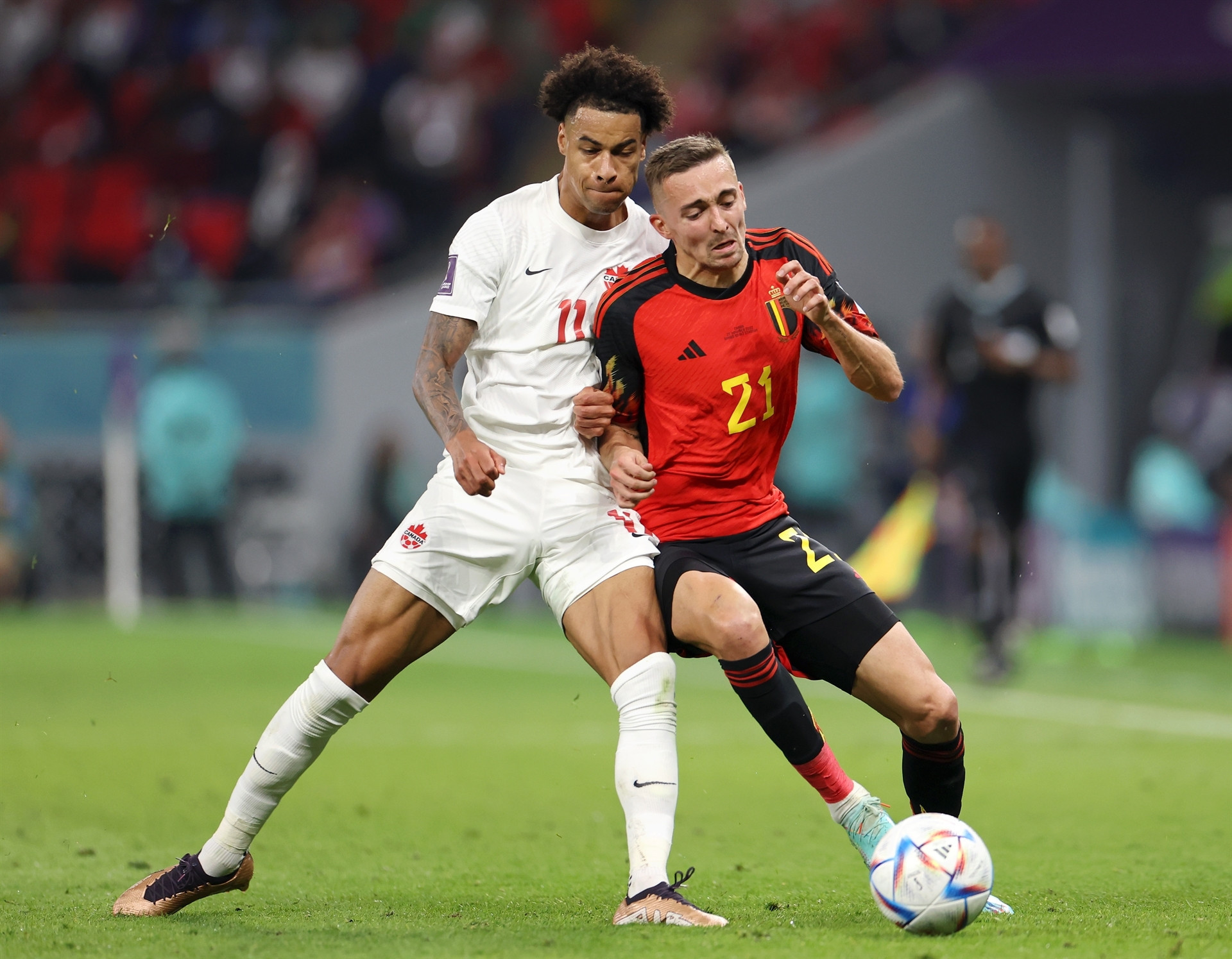 DOHA, QATAR - NOVEMBER 23: Tajon Buchanan of Canada battles for possession with Timothy Castagne of Belgium  during the FIFA World Cup Qatar 2022 Group F match between Belgium and Canada at Ahmad Bin Ali Stadium on November 23, 2022 in Doha, Qatar. (Photo by Catherine Ivill/Getty Images)