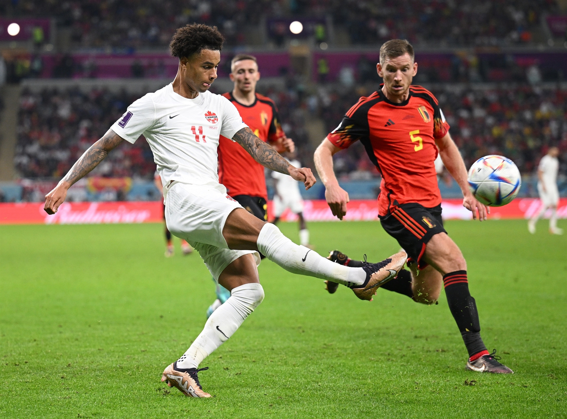 DOHA, QATAR - NOVEMBER 23: Tajon Buchanan of Canada controls the ball against Jan Vertonghen of Belgium during the FIFA World Cup Qatar 2022 Group F match between Belgium and Canada at Ahmad Bin Ali Stadium on November 23, 2022 in Doha, Qatar. (Photo by Matthias Hangst/Getty Images)