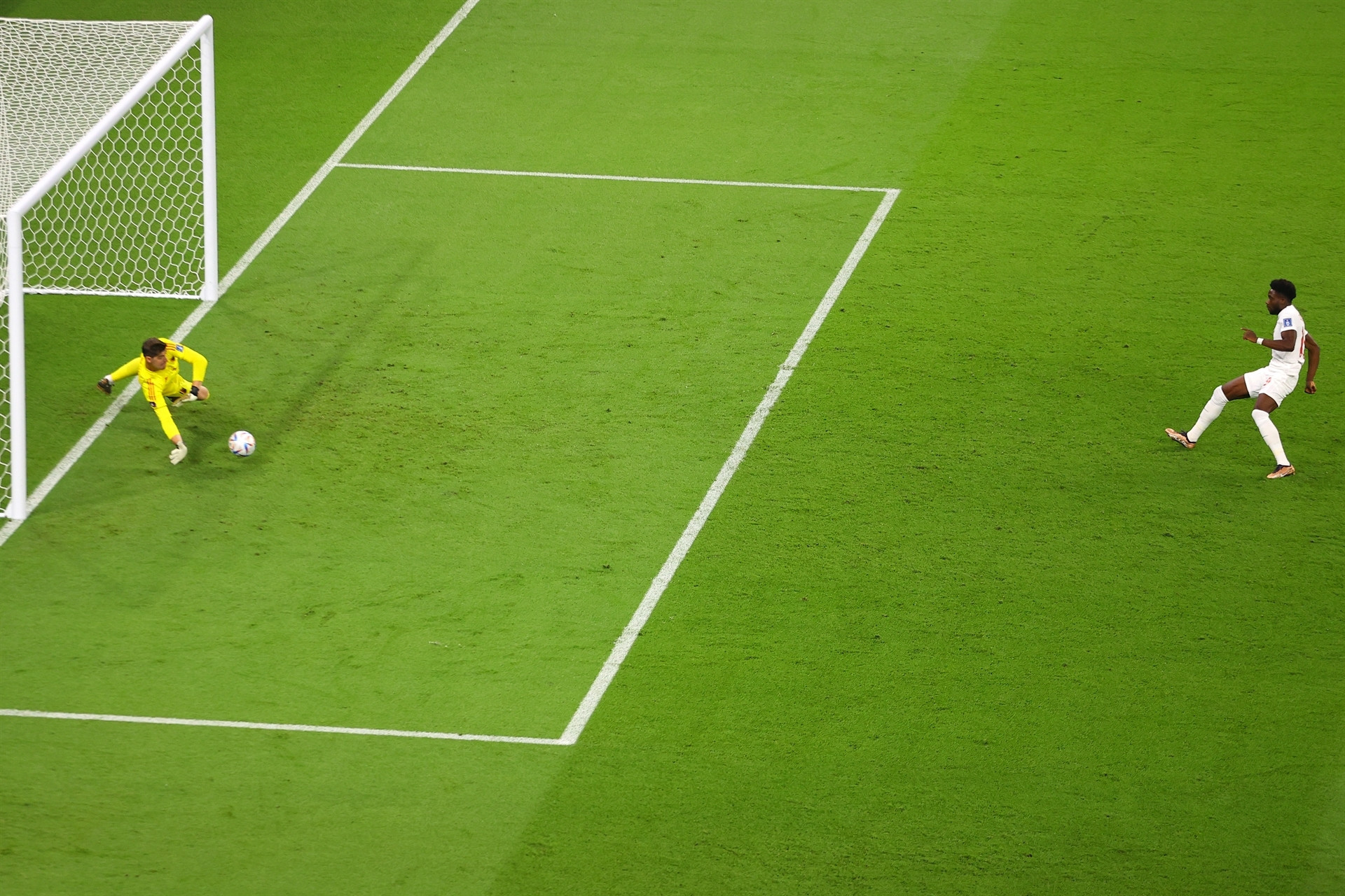 DOHA, QATAR - NOVEMBER 23: Thibaut Courtois of Belgium saves the penalty taken by Alphonso Davies of Canada during the FIFA World Cup Qatar 2022 Group F match between Belgium and Canada at Ahmad Bin Ali Stadium on November 23, 2022 in Doha, Qatar. (Photo by Richard Heathcote/Getty Images)
