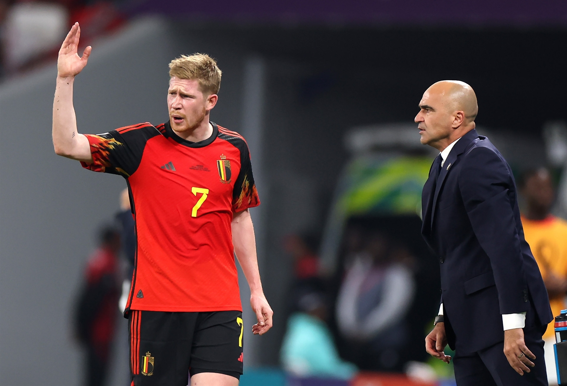 DOHA, QATAR - NOVEMBER 23: Roberto Martinez, Head Coach of Belgium, speaks with Kevin De Bruyne during the FIFA World Cup Qatar 2022 Group F match between Belgium and Canada at Ahmad Bin Ali Stadium on November 23, 2022 in Doha, Qatar. (Photo by Catherine Ivill/Getty Images)