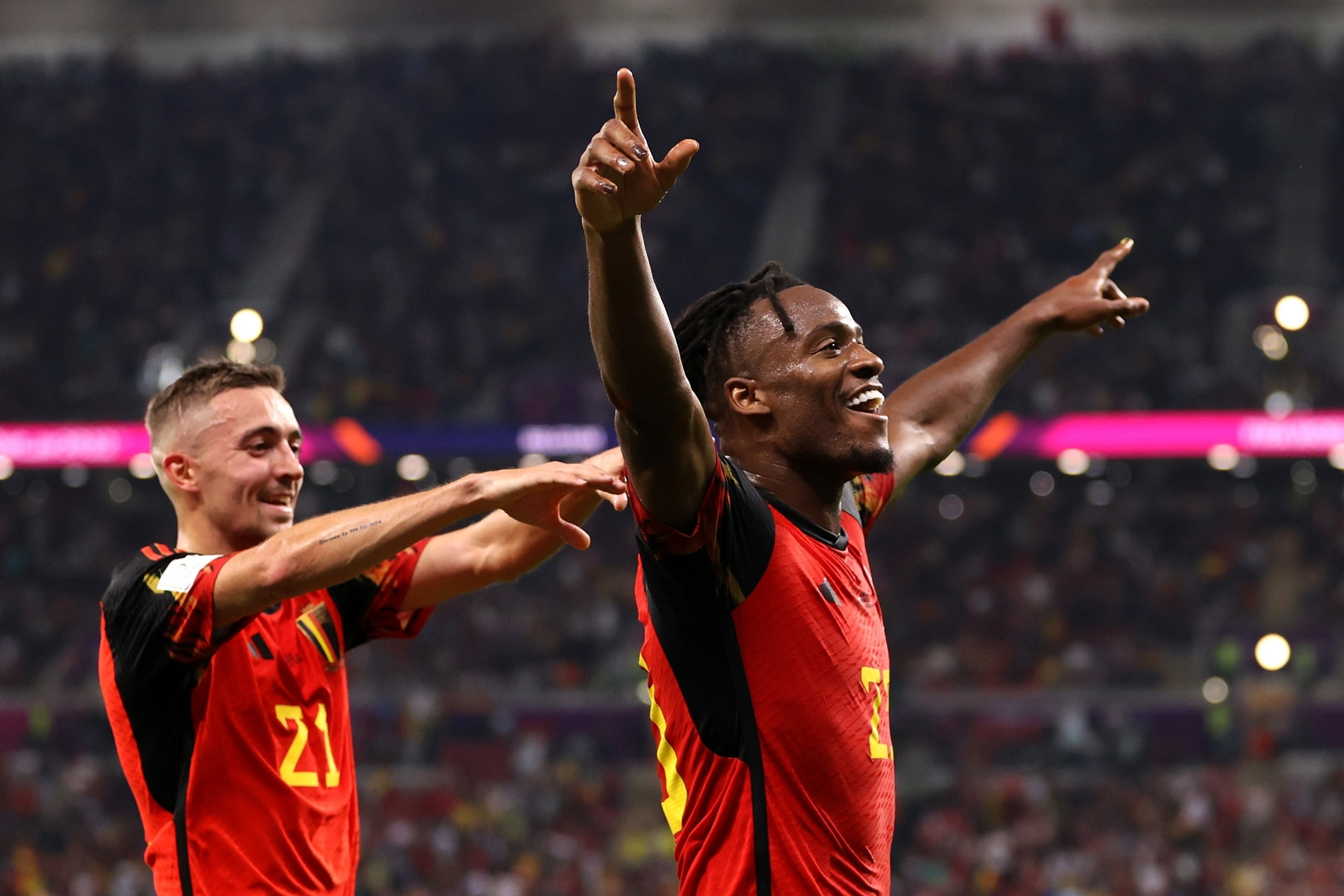 DOHA, QATAR - NOVEMBER 23: Michy Batshuayi of Belgium celebrates scoring their first goal with their teammate Timothy Castagne during the FIFA World Cup Qatar 2022 Group F match between Belgium and Canada at Ahmad Bin Ali Stadium on November 23, 2022 in Doha, Qatar. (Photo by Clive Brunskill/Getty Images)
