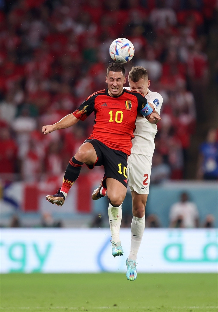 DOHA, QATAR - NOVEMBER 23: Eden Hazard of Belgium and Alistair Johnston of Canada battle for the ball during the FIFA World Cup Qatar 2022 Group F match between Belgium and Canada at Ahmad Bin Ali Stadium on November 23, 2022 in Doha, Qatar. (Photo by Julian Finney/Getty Images)