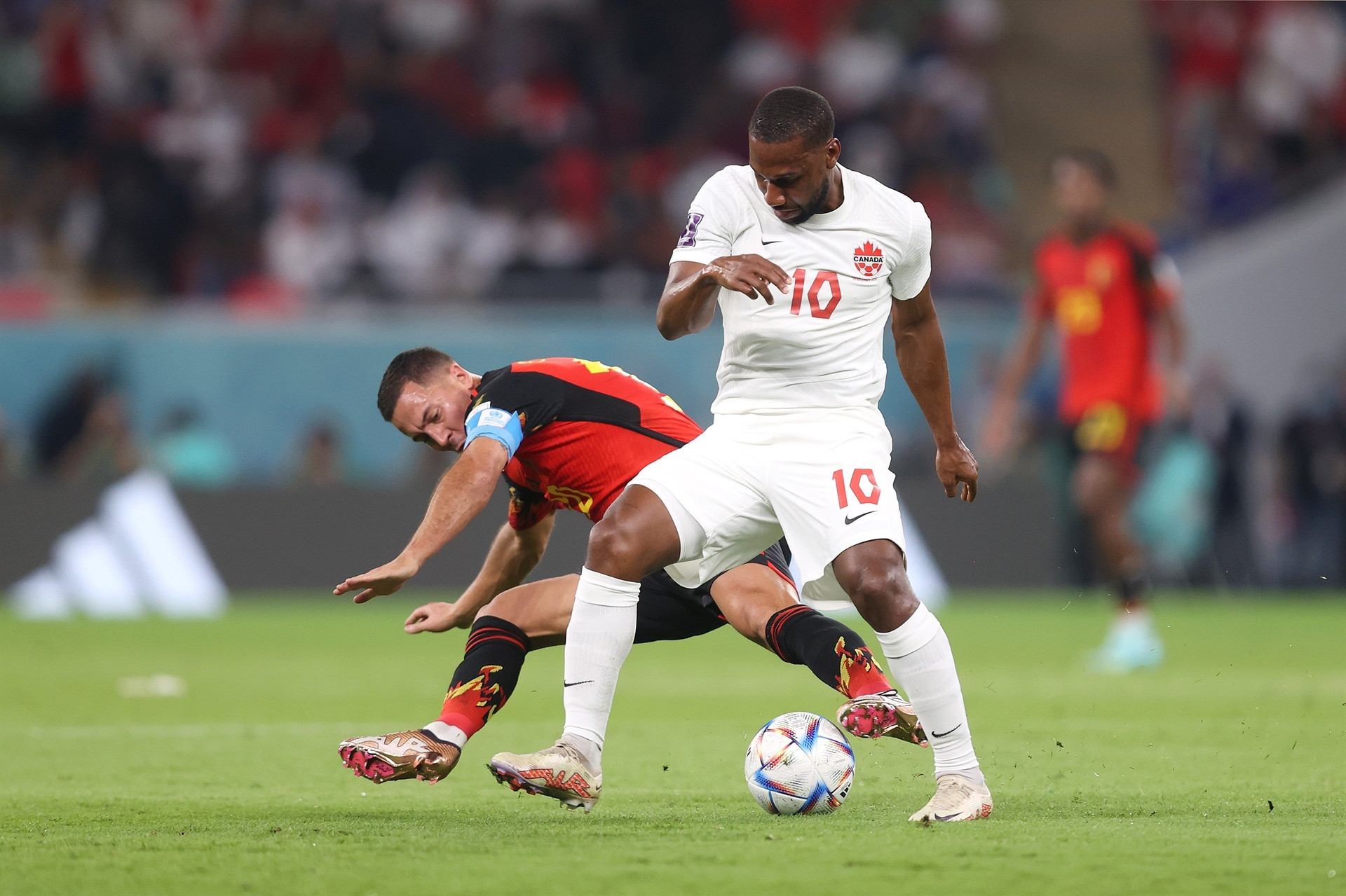 DOHA, QATAR - NOVEMBER 23: Junior Hoilett of Canada controls the ball against Eden Hazard of Belgium during the FIFA World Cup Qatar 2022 Group F match between Belgium and Canada at Ahmad Bin Ali Stadium on November 23, 2022 in Doha, Qatar. (Photo by Julian Finney/Getty Images)