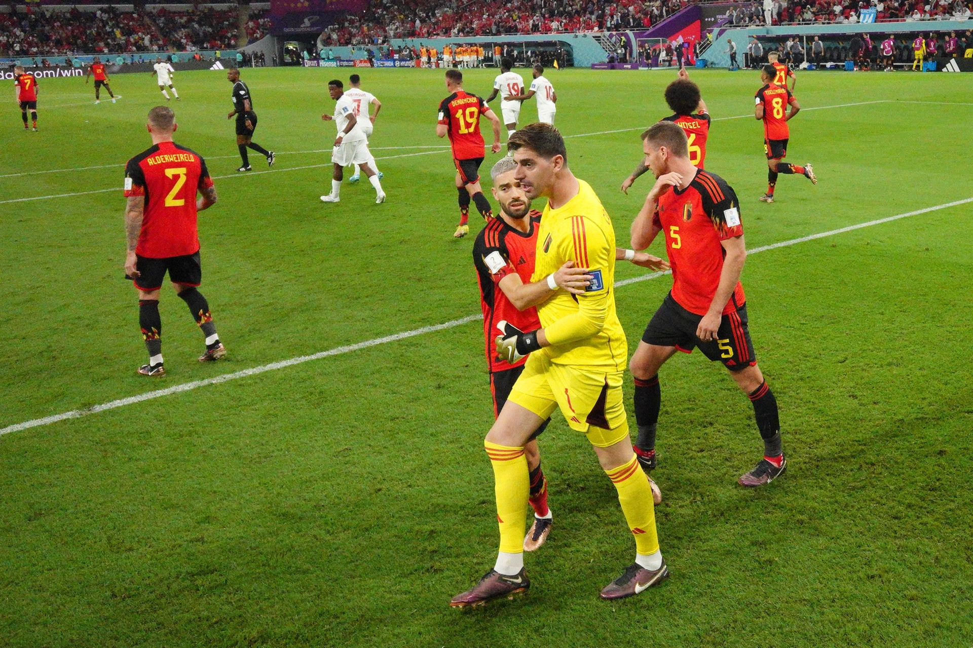DOHA, QATAR - NOVEMBER 23: (EDITORS NOTE: In this photo taken from a remote camera from inside the goal) Thibaut Courtois of Belgium celebrates after saving the penalty taken by Alphonso Davies of Canada during the FIFA World Cup Qatar 2022 Group F match between Belgium and Canada at Ahmad Bin Ali Stadium on November 23, 2022 in Doha, Qatar. (Photo by Julian Finney/Getty Images)