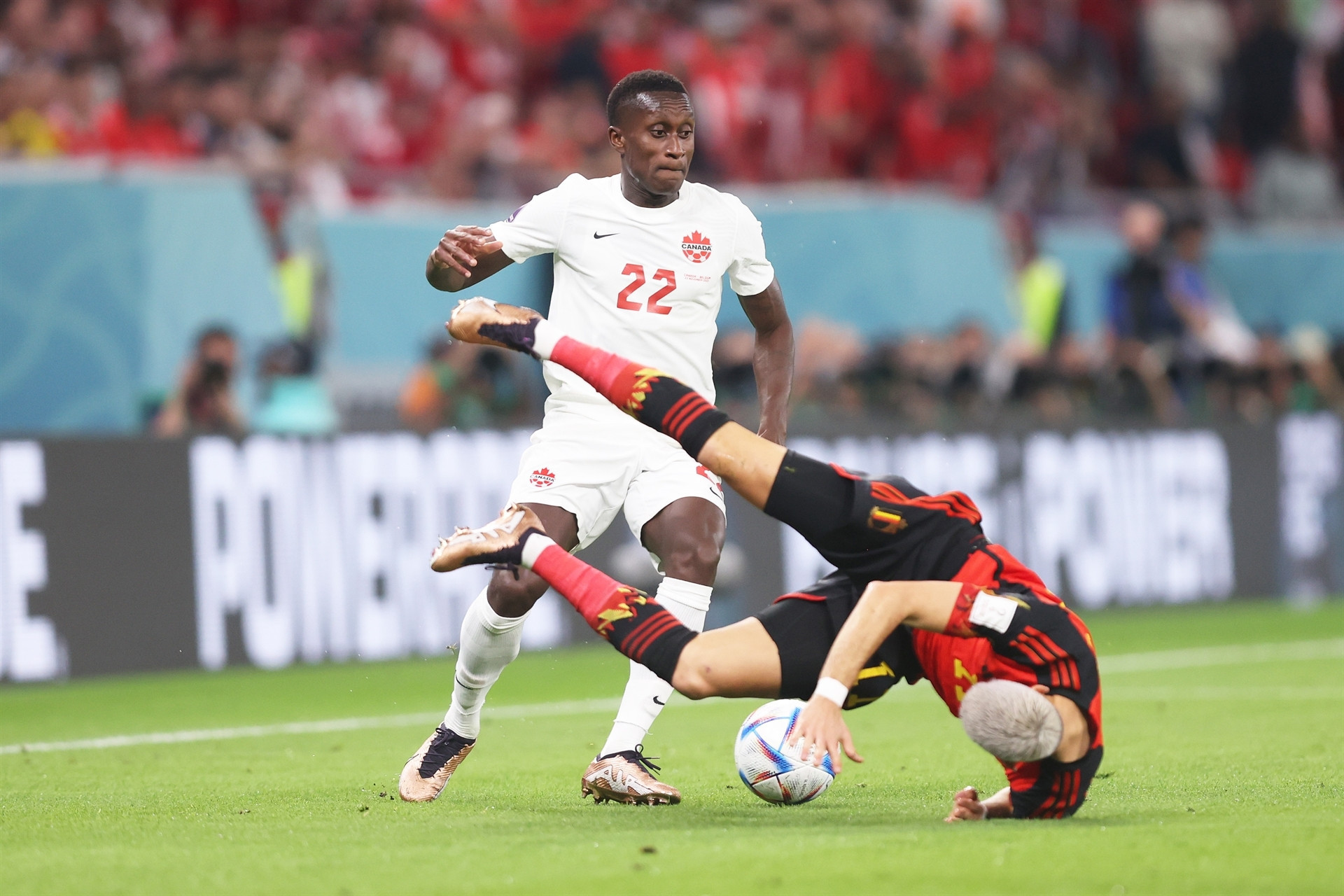 DOHA, QATAR - NOVEMBER 23: Yannick Carrasco of Belgium is challenged by Richie Laryea of Canada during the FIFA World Cup Qatar 2022 Group F match between Belgium and Canada at Ahmad Bin Ali Stadium on November 23, 2022 in Doha, Qatar. (Photo by Julian Finney/Getty Images)