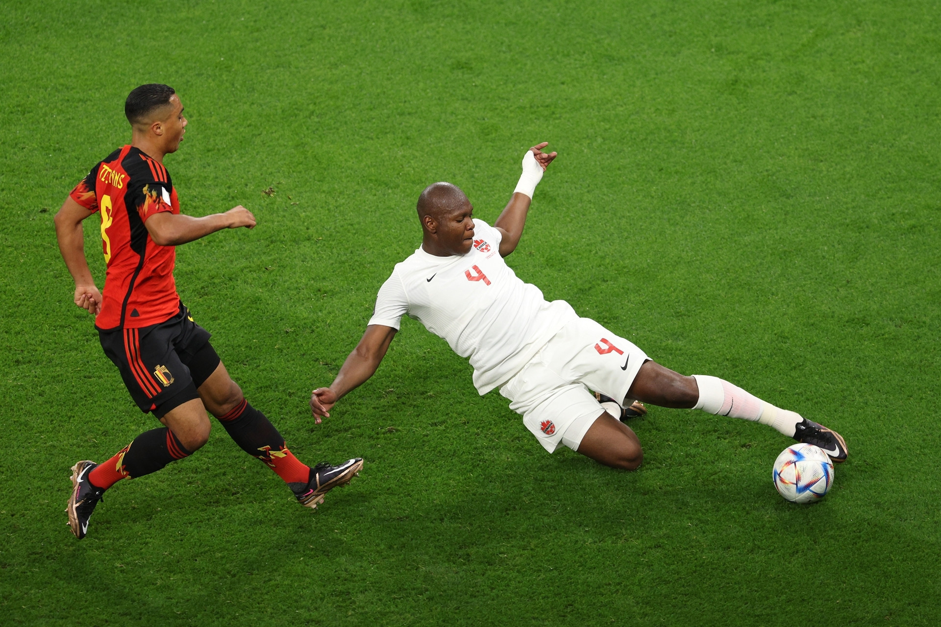 DOHA, QATAR - NOVEMBER 23: Kamal Miller of Canada battles for possession with Youri Tielemans of Belgium during the FIFA World Cup Qatar 2022 Group F match between Belgium and Canada at Ahmad Bin Ali Stadium on November 23, 2022 in Doha, Qatar. (Photo by Richard Heathcote/Getty Images)