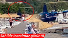Muğlanın Marmaris ilçesinde tepki çeken görüntü Helikopter sahile indi