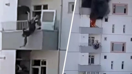 Niğdede yangında balkondan atlayan kadını komşusu böyle yakaladı... O anlar kamerada