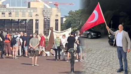 Bayrağı kaptığı gibi karşılarına dikildi