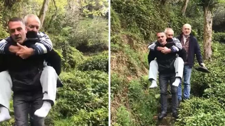 Muhtar, evine yol gitmeyen hasta köylüsünü sırtında taşıdı