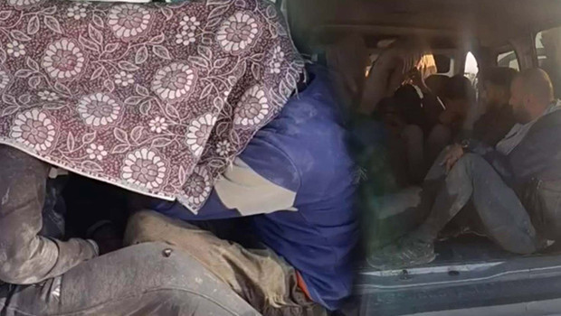 Hatay'da kaçak göçmen operasyonu: Üzerlerini kamuflajla örtmüşler