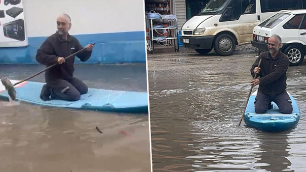 İlçede etkili olan sağanak sonrası sokakları su bastı: Araç tamir ustası SUP board yaptı!